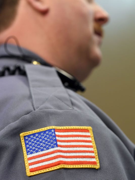 police uniform shoulder patch placement